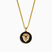 Mens 14K Yellow Gold Black Diamond Lion Pendant features a detailed lion head on a black background, set in a circular gold frame for bold elegance.