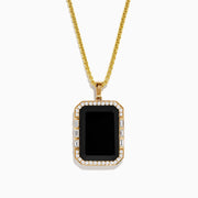 The Mens 14K Yellow Gold Black Onyx and Diamond Pendant features a rectangular black onyx bordered by diamonds, hanging from a delicate gold chain against a white background.
