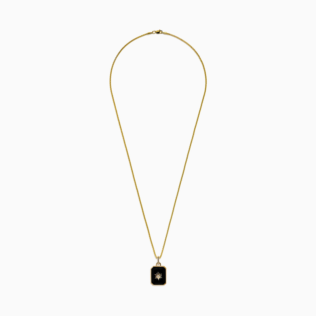 A 14K yellow gold agate and diamond pendant necklace with a rectangular black agate, gold starburst design, and a small central diamond, shown on a plain white background.