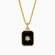 A 14K yellow gold agate and diamond pendant necklace with a rectangular black agate, gold starburst design, and a small central diamond, shown on a plain white background.