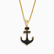 The Men's 14K Yellow Gold Black Diamond Anchor Pendant features a yellow gold chain and an anchor-shaped pendant adorned with small black diamonds, geometric details at the top, and pointed arrow-like ends.