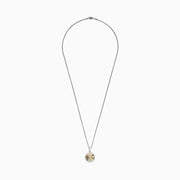 This Novelty 14K white and yellow gold coin pendant features a diamond anchor at the center of a gold sunburst design, all set on a silver chain and surrounded by a border of sparkling diamonds.