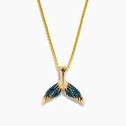 This men's 14K yellow gold necklace features a whales tail pendant accented with blue diamonds on each fin. Both the chain and pendant have a shiny, polished finish.