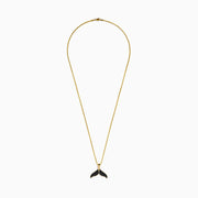 The Men's 14K Yellow Gold Black Diamond Whales Tail Pendant features black diamonds on each fin and hangs from a delicate chain, shown against a plain white background.