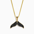The Men's 14K Yellow Gold Black Diamond Whales Tail Pendant features black diamonds on each fin and hangs from a delicate chain, shown against a plain white background.