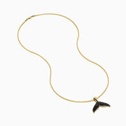 The Men's 14K Yellow Gold Black Diamond Whales Tail Pendant features black diamonds on each fin and hangs from a delicate chain, shown against a plain white background.