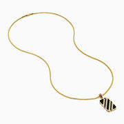 This men's 14K yellow gold dog tag pendant features black onyx, black diamonds, and a modern geometric design with chamfered corners.