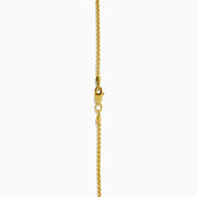 Men's 14K yellow gold dog tag pendant featuring malachite bordered by black onyx and gold accents, divided horizontally by a slim black bar with sparkling details.