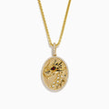 Mens 14K Yellow Gold Diamond and Ruby Dragon Pendant featuring an engraved dragon head with a ruby eye, bordered by diamonds on an oval medallion and hung on a gold chain—a bold and striking men’s jewelry choice.