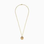 The Men's 14K Yellow Gold Diamond Dragon Pendant showcases an octagonal design with textured details, clear stones, and a vivid green stone eye, all suspended from a classic gold chain.