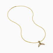 Men's 14K yellow gold diamond whales tail pendant with each fin accented by sparkling diamonds, shown on a white background.