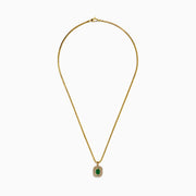 The 14K Yellow Gold Emerald and Diamond Double Halo Pendant showcases a rectangular green emerald surrounded by two sparkling diamond halos, displayed on a white background.