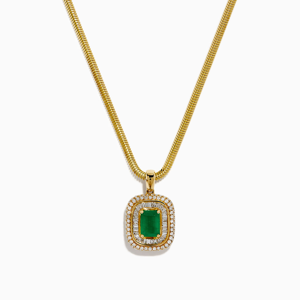 The 14K Yellow Gold Emerald and Diamond Double Halo Pendant showcases a rectangular green emerald surrounded by two sparkling diamond halos, displayed on a white background.