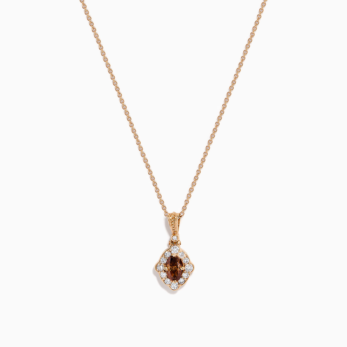 The 14K Rose Gold Brown and White Diamond Halo Pendant features an oval brown and white diamond surrounded by small clear stones in a decorative setting.