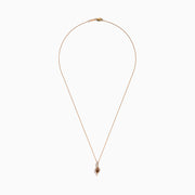 The Espresso 14K Rose Gold Brown and White Diamond Pendant features an oval brown gemstone surrounded by white diamonds in a swirling design, gracefully hanging from a delicate rose gold chain.