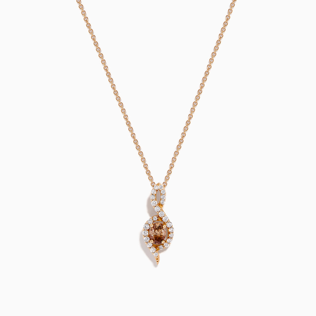 The Espresso 14K Rose Gold Brown and White Diamond Pendant features an oval brown gemstone surrounded by white diamonds in a swirling design, gracefully hanging from a delicate rose gold chain.