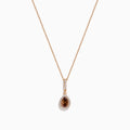 The 14K Rose Gold Pear Halo Brown and White Diamond Pendant features a teardrop-shaped brown and white diamond centerpiece, bordered with sparkling clear stones and accented by a vertical row of clear stones above.