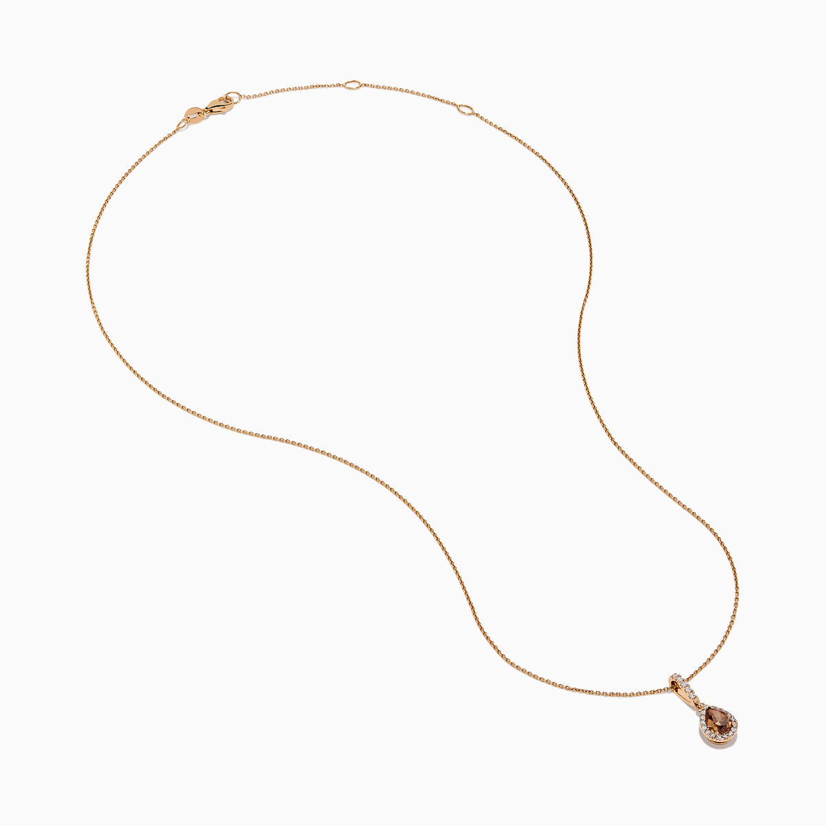 The 14K Rose Gold Pear Halo Brown and White Diamond Pendant features a teardrop-shaped brown and white diamond centerpiece, bordered with sparkling clear stones and accented by a vertical row of clear stones above.