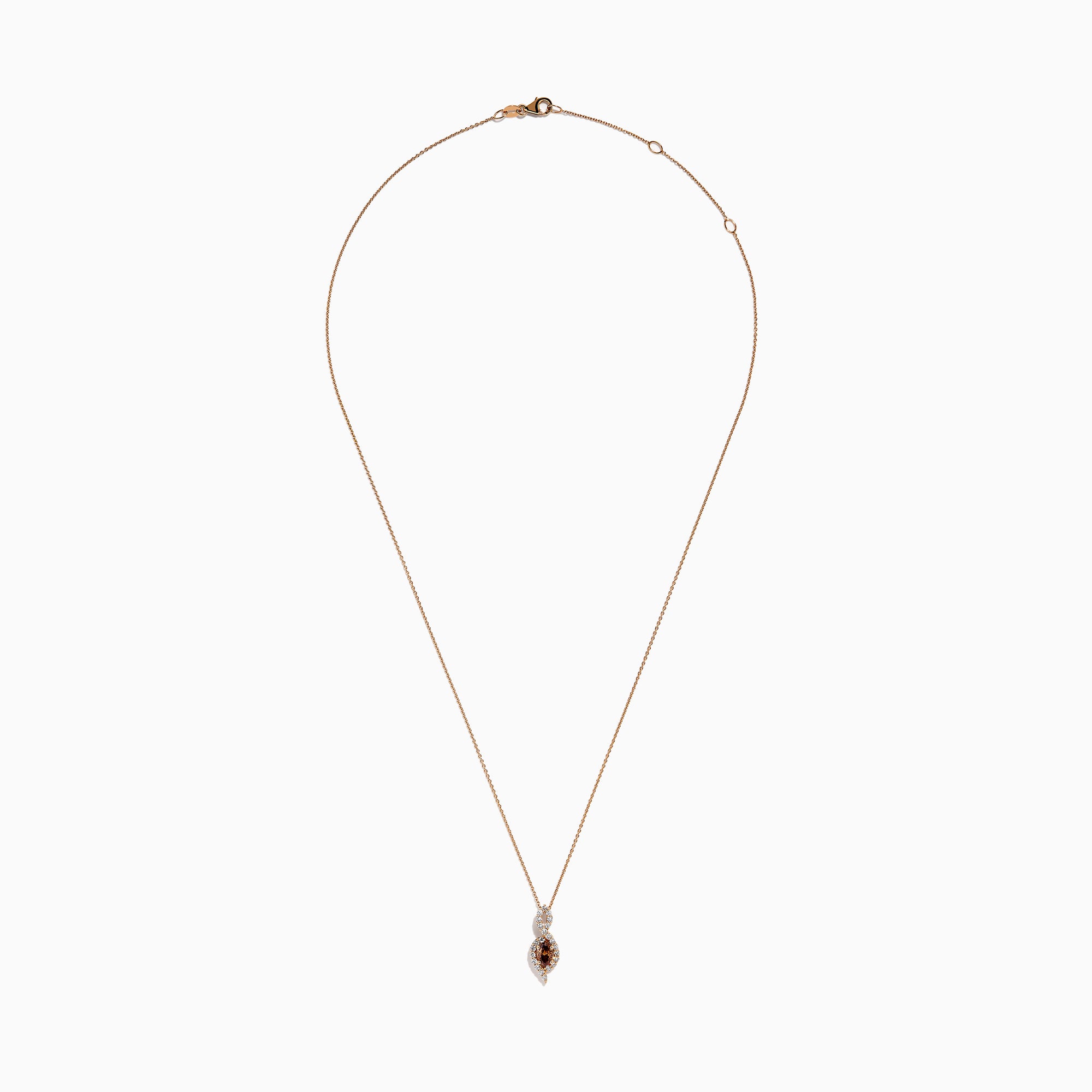 The 14K Rose Gold Brown and White Diamond Pendant features a marquise-shaped brown gemstone at its center, highlighted by a twisting design set with sparkling brown and white diamonds.