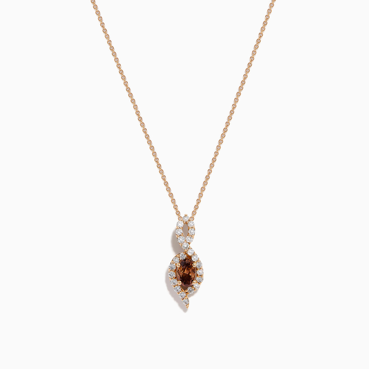 The 14K Rose Gold Brown and White Diamond Pendant features a marquise-shaped brown gemstone at its center, highlighted by a twisting design set with sparkling brown and white diamonds.
