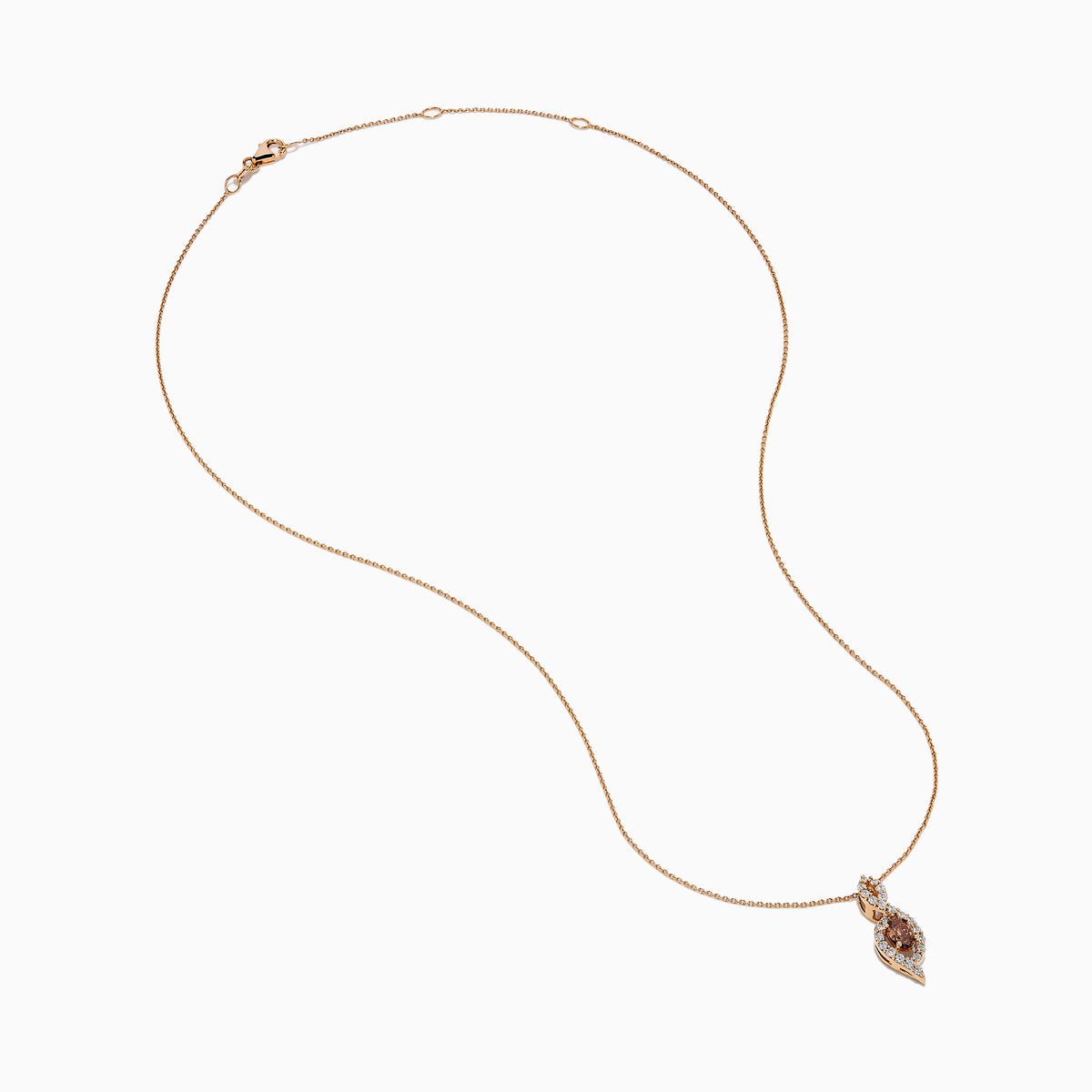 The 14K Rose Gold Brown and White Diamond Pendant features a marquise-shaped brown gemstone at its center, highlighted by a twisting design set with sparkling brown and white diamonds.