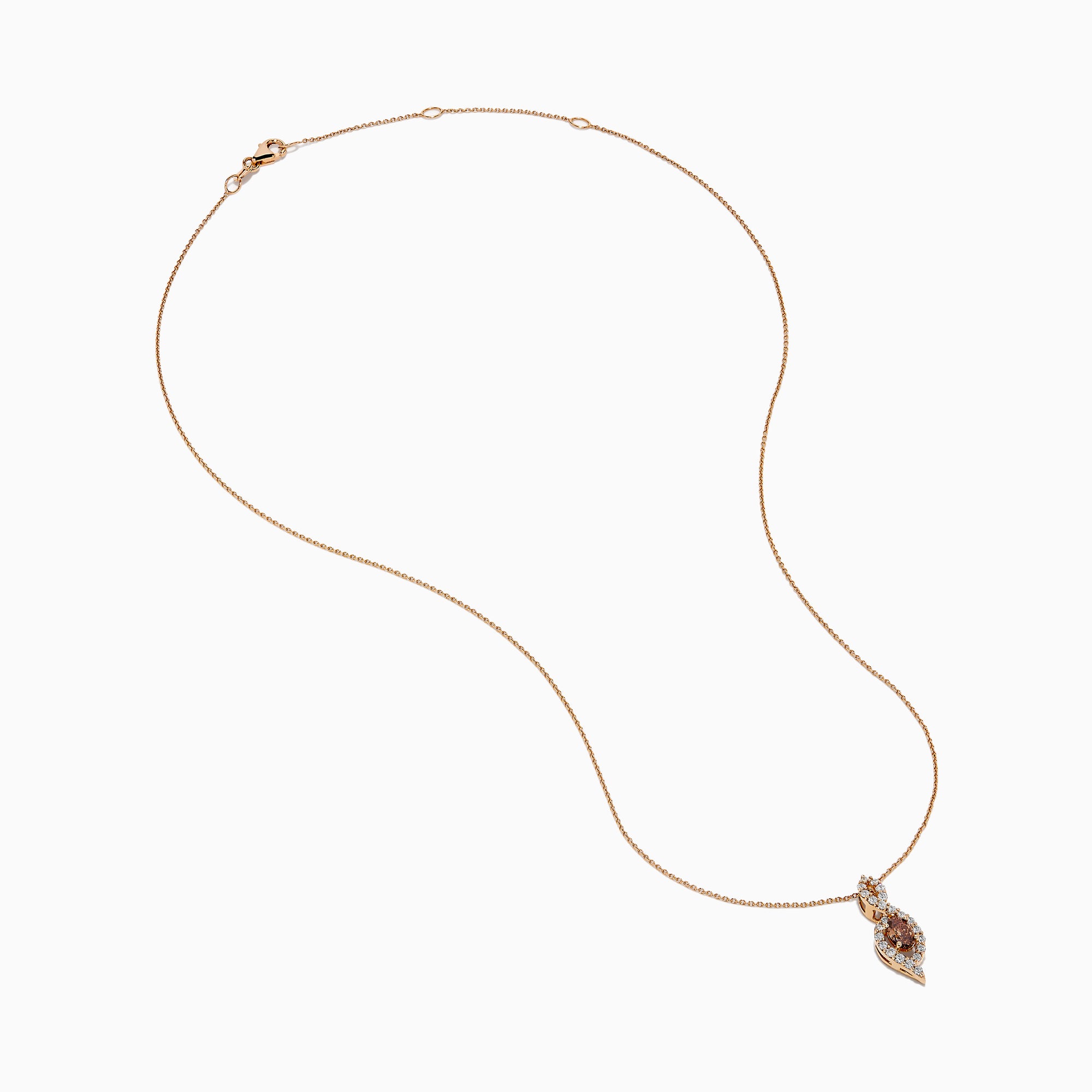 The 14K Rose Gold Brown and White Diamond Pendant features a marquise-shaped brown gemstone at its center, highlighted by a twisting design set with sparkling brown and white diamonds.