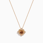 The 14K Rose Gold Brown and White Diamond Pendant features a flower-shaped design with a central brown and white diamond, accented by clear stones, shown on a white background.