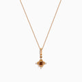 A 14K rose gold chain necklace featuring a pendant with brown and white diamonds.