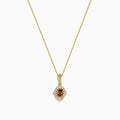 The 14K Yellow Gold Brown and White Diamond Pendant features a delicate gold chain with a central brown diamond, accented by smaller white diamonds in a floral-inspired design.