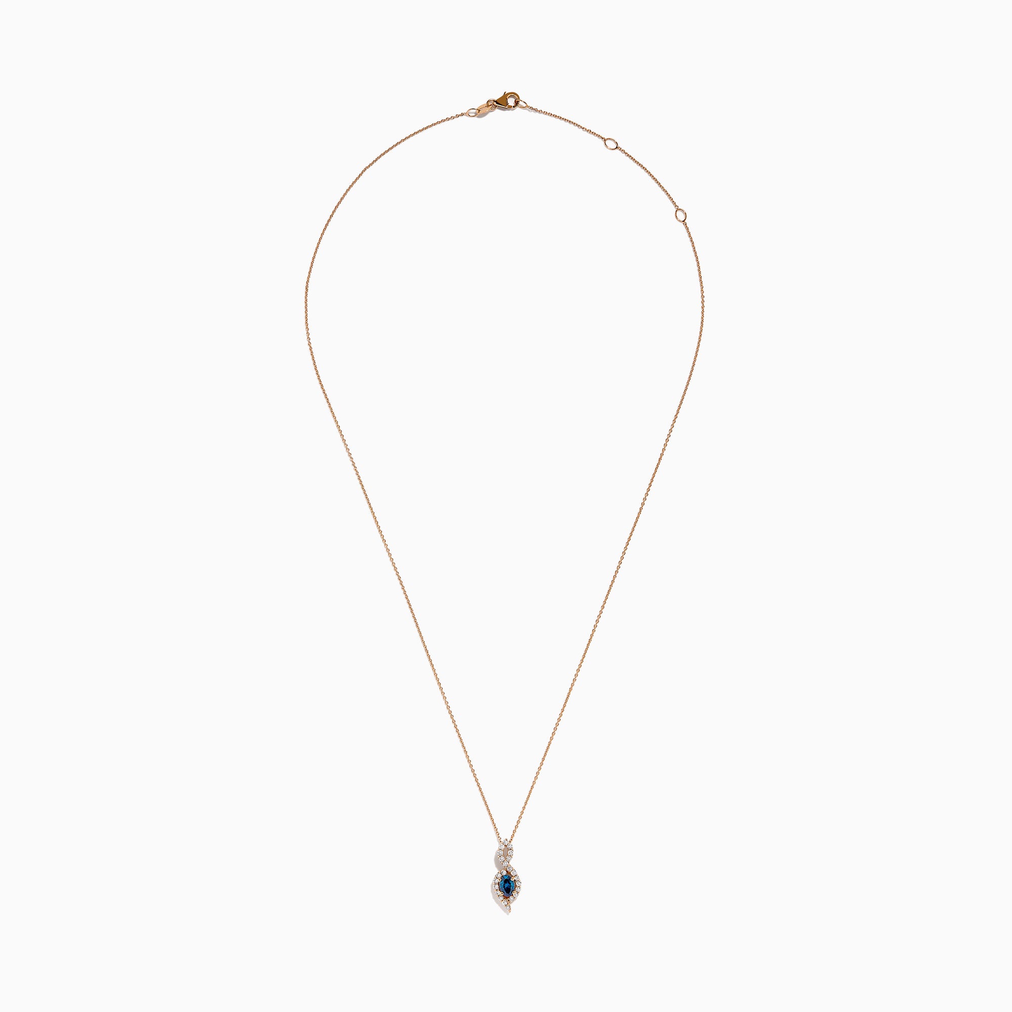 The 14K Rose Gold Blue and White Diamond Pendant features a deep blue oval gemstone with sparkling blue and white diamonds set in a twisting, teardrop-shaped design.