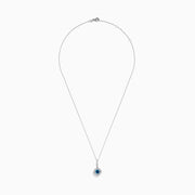 The Bella Bleu 14K White Gold Blue and White Diamond Pendant features a central blue diamond surrounded by a halo of white diamonds, displayed against a plain white background.
