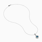 The Bella Bleu 14K White Gold Blue and White Diamond Pendant features a central blue diamond surrounded by a halo of white diamonds, displayed against a plain white background.