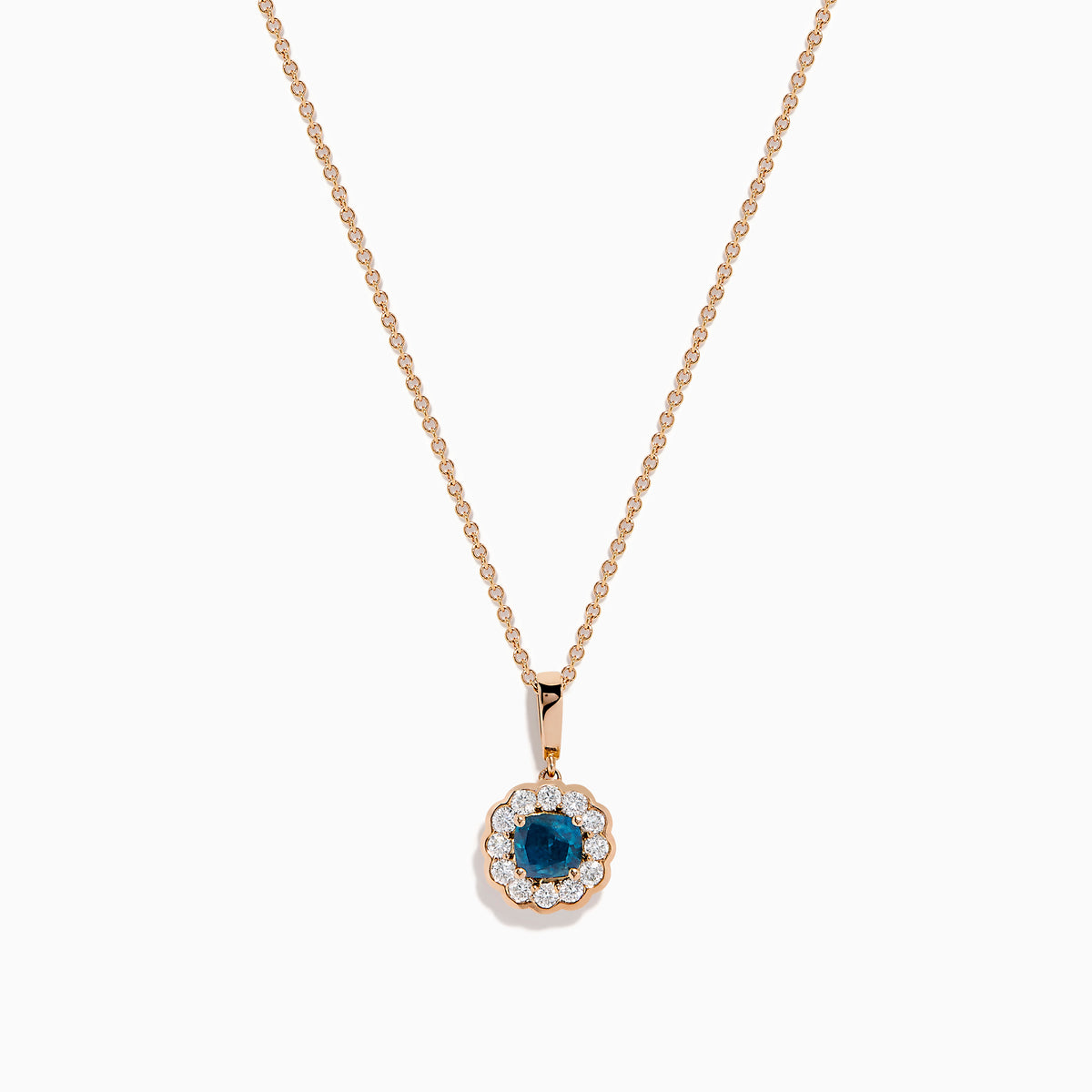 The Bella Bleu 14K Rose Gold Blue and White Diamond Pendant features a round dark blue gemstone center, encircled by sparkling white diamonds, all on a rose gold chain and shown against a white background.