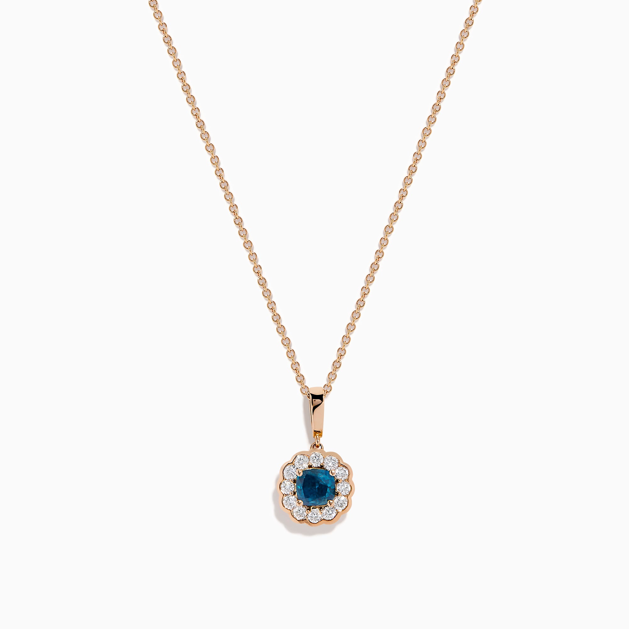 The Bella Bleu 14K Rose Gold Blue and White Diamond Pendant features a round dark blue gemstone center, encircled by sparkling white diamonds, all on a rose gold chain and shown against a white background.