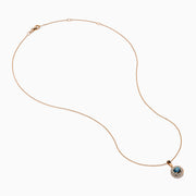 The Bella Bleu 14K Rose Gold Blue and White Diamond Pendant features a round dark blue gemstone center, encircled by sparkling white diamonds, all on a rose gold chain and shown against a white background.
