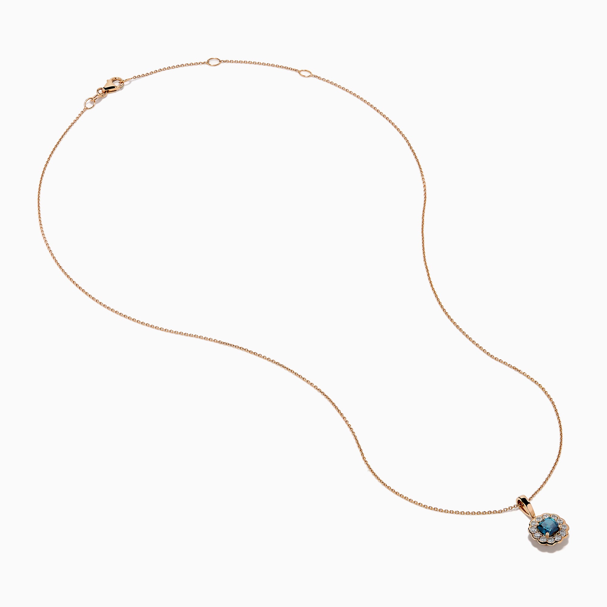 The Bella Bleu 14K Rose Gold Blue and White Diamond Pendant features a round dark blue gemstone center, encircled by sparkling white diamonds, all on a rose gold chain and shown against a white background.