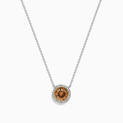 The Espresso 18K Two-Tone Gold Brown and White Diamond Necklace, featuring a round brown diamond surrounded by a halo of white diamonds, is elegantly displayed on a white background.