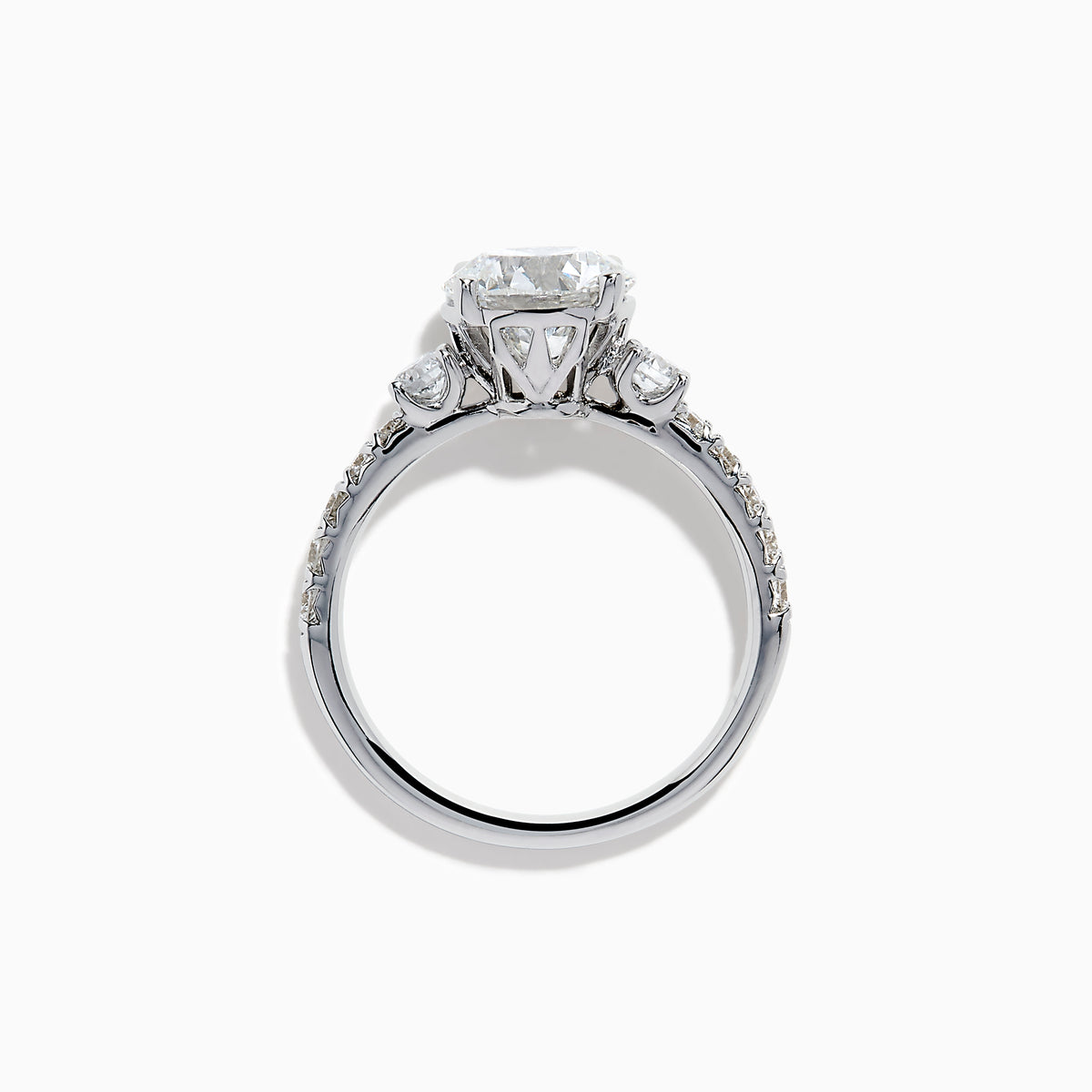 The Star Lab Grown Diamond Ring in 18K White Gold showcases a large round-cut lab diamond center with smaller diamonds along the band, beautifully displayed on a white background.