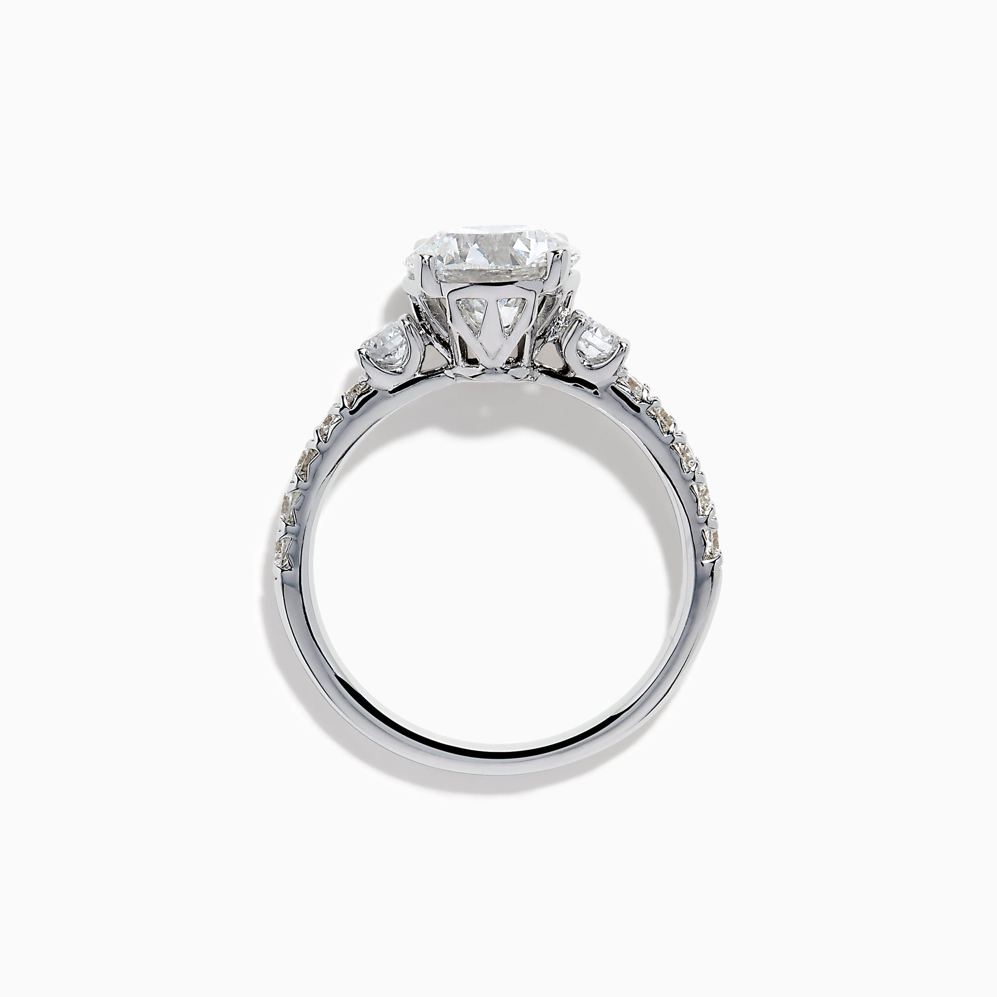 The Star Lab Grown Diamond Ring in 18K White Gold showcases a large round-cut lab diamond center with smaller diamonds along the band, beautifully displayed on a white background.