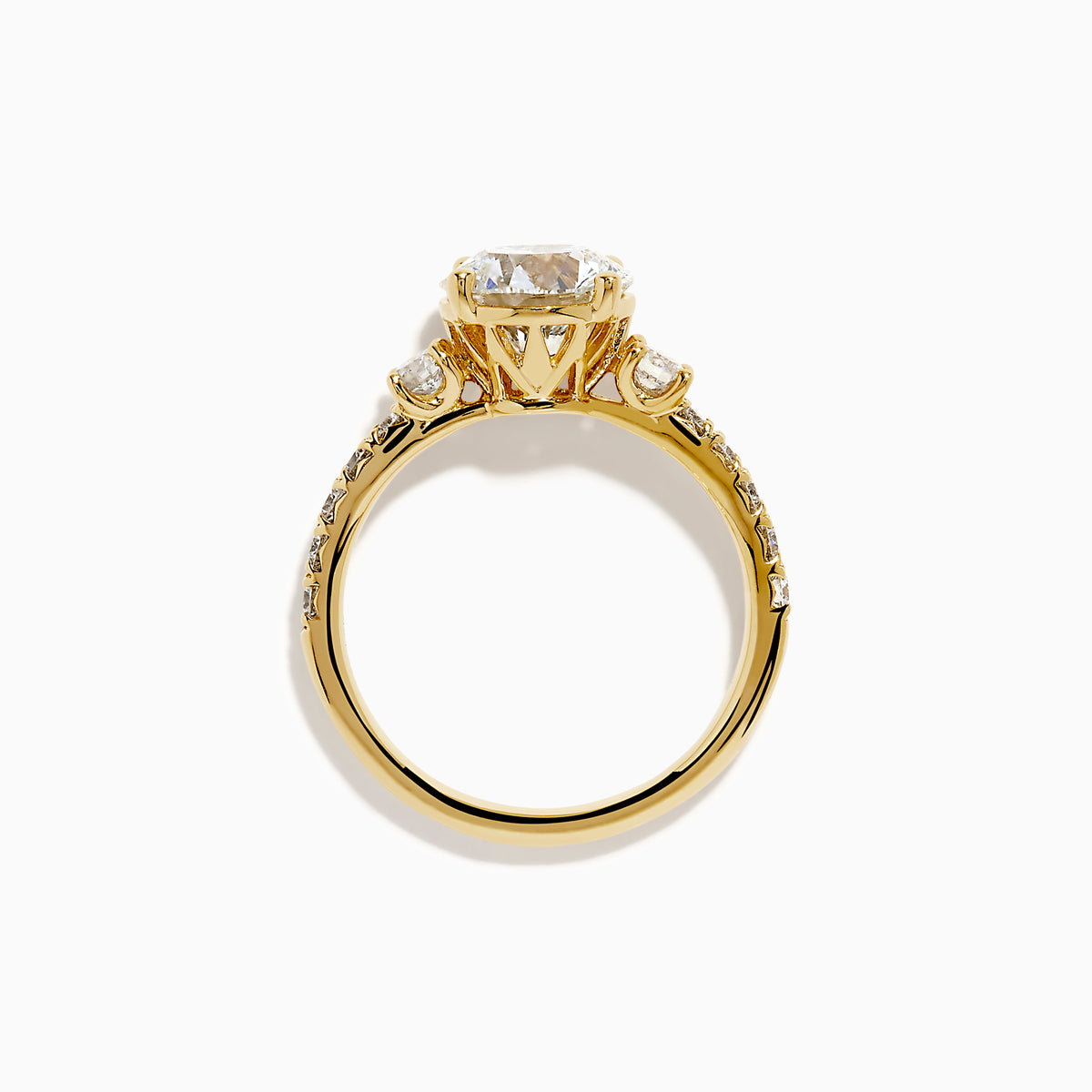 The Star Lab Grown Diamond Ring in 18K yellow gold features a large round center stone with smaller diamonds along the band, shown against a white background.