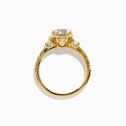 The Star Lab Grown Diamond Ring in 18K yellow gold features a large round center stone with smaller diamonds along the band, shown against a white background.