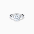 The Star Lab Grown Diamond Ring in 18K White Gold features a large oval lab diamond center with two round diamonds on each side, beautifully set and displayed on a white background.