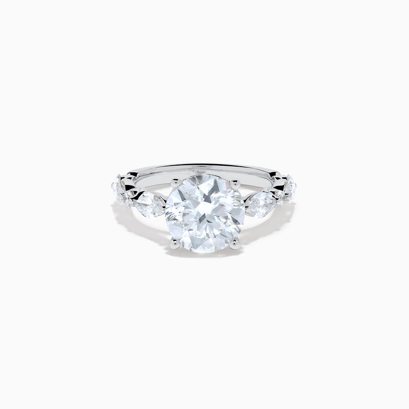 The Star Lab Grown Diamond Ring in 18K White Gold features a large oval lab diamond center with two round diamonds on each side, beautifully set and displayed on a white background.