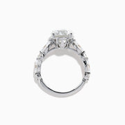 The Star Lab Grown Diamond Ring in 18K White Gold features a large oval lab diamond center with two round diamonds on each side, beautifully set and displayed on a white background.