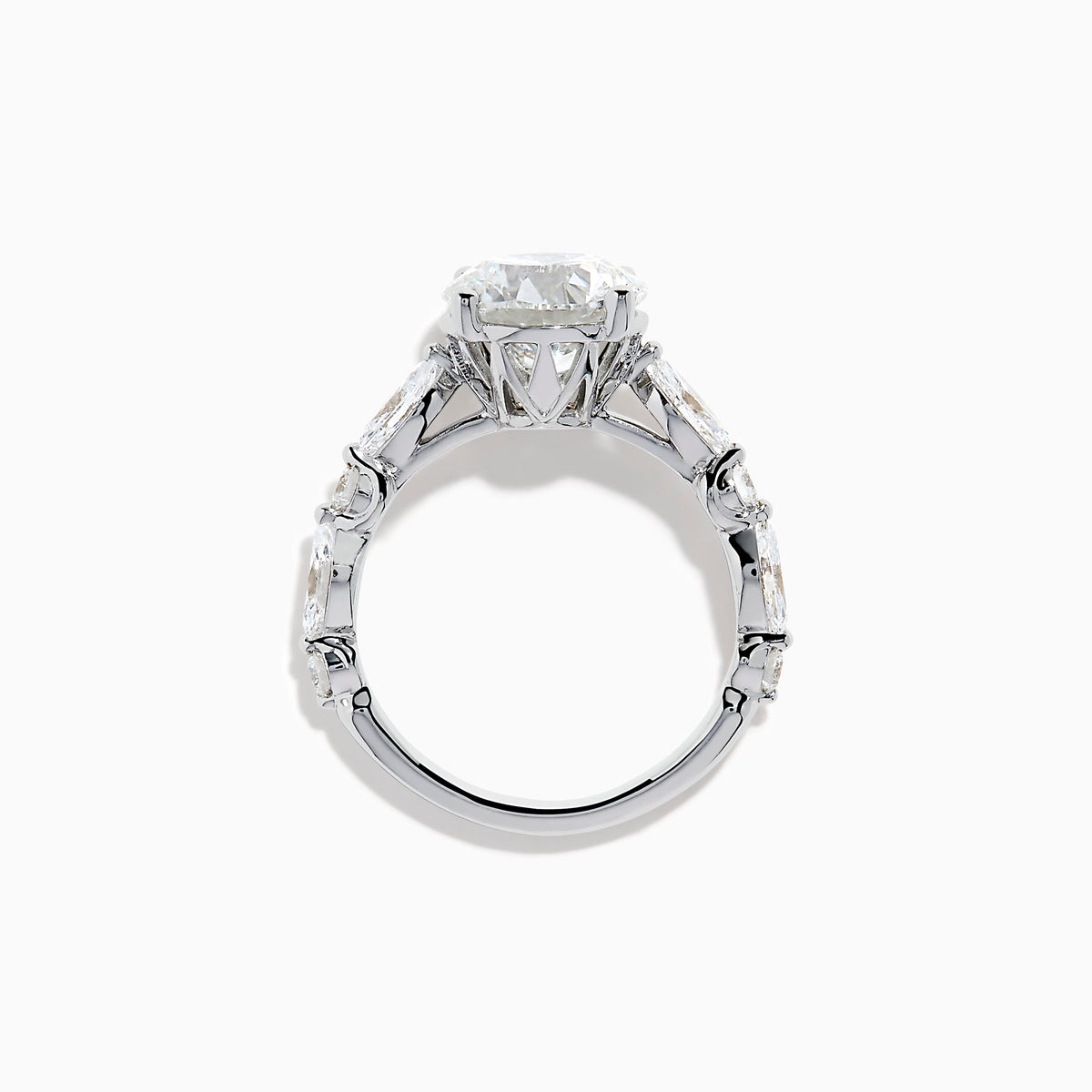 The Star Lab Grown Diamond Ring in 18K White Gold features a large oval lab diamond center with two round diamonds on each side, beautifully set and displayed on a white background.