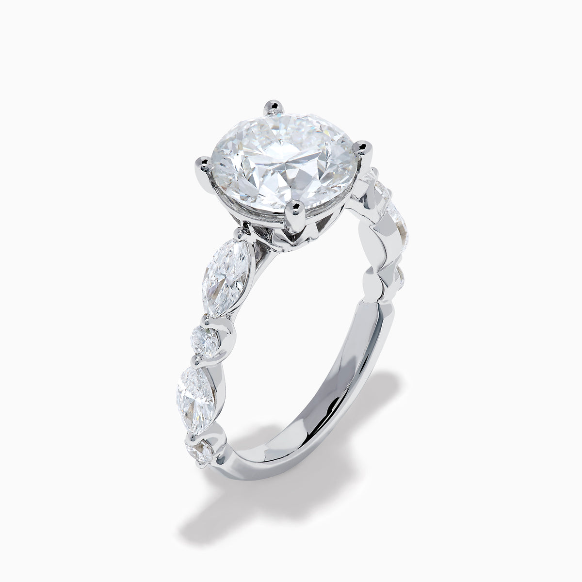 The Star Lab Grown Diamond Ring in 18K White Gold features a large oval lab diamond center with two round diamonds on each side, beautifully set and displayed on a white background.