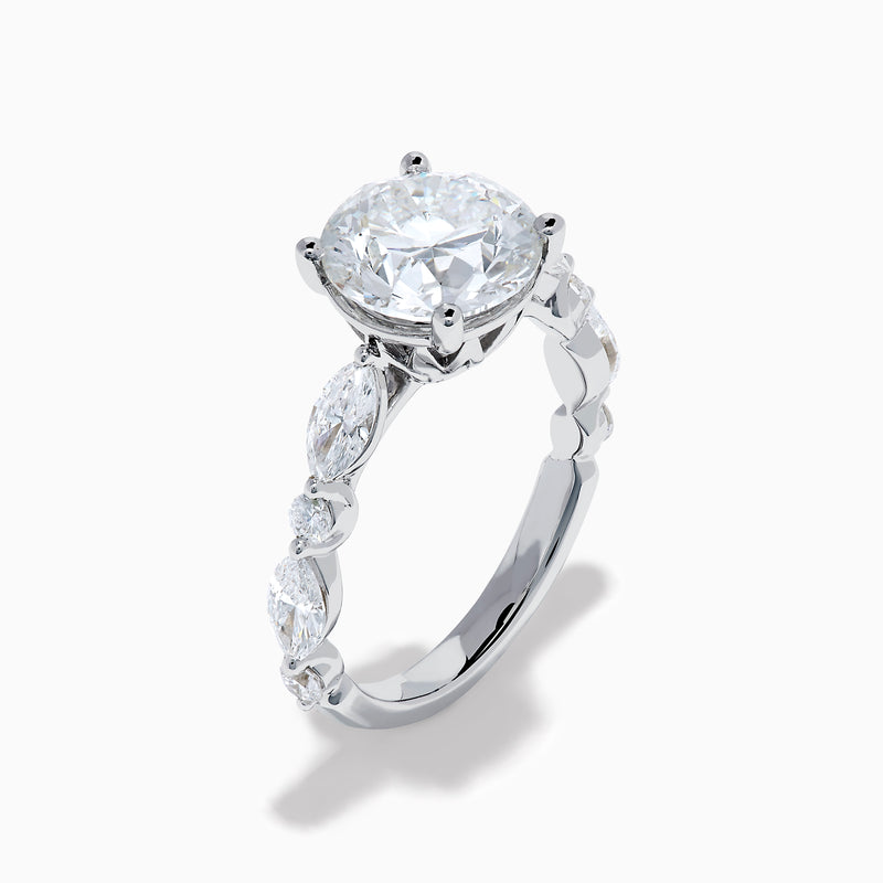 The Star Lab Grown Diamond Ring in 18K White Gold features a large oval lab diamond center with two round diamonds on each side, beautifully set and displayed on a white background.