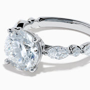 The Star Lab Grown Diamond Ring in 18K White Gold features a large oval lab diamond center with two round diamonds on each side, beautifully set and displayed on a white background.