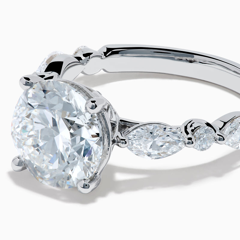 The Star Lab Grown Diamond Ring in 18K White Gold features a large oval lab diamond center with two round diamonds on each side, beautifully set and displayed on a white background.