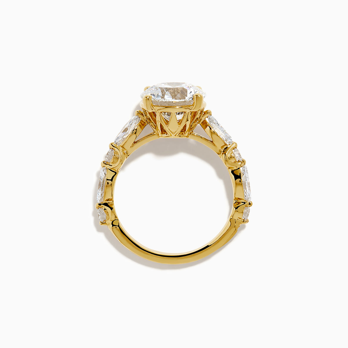 The Star Lab Grown Diamond Ring in 18K Yellow Gold features a large round lab diamond center, accented by three smaller diamonds on each side, all set against a white background.